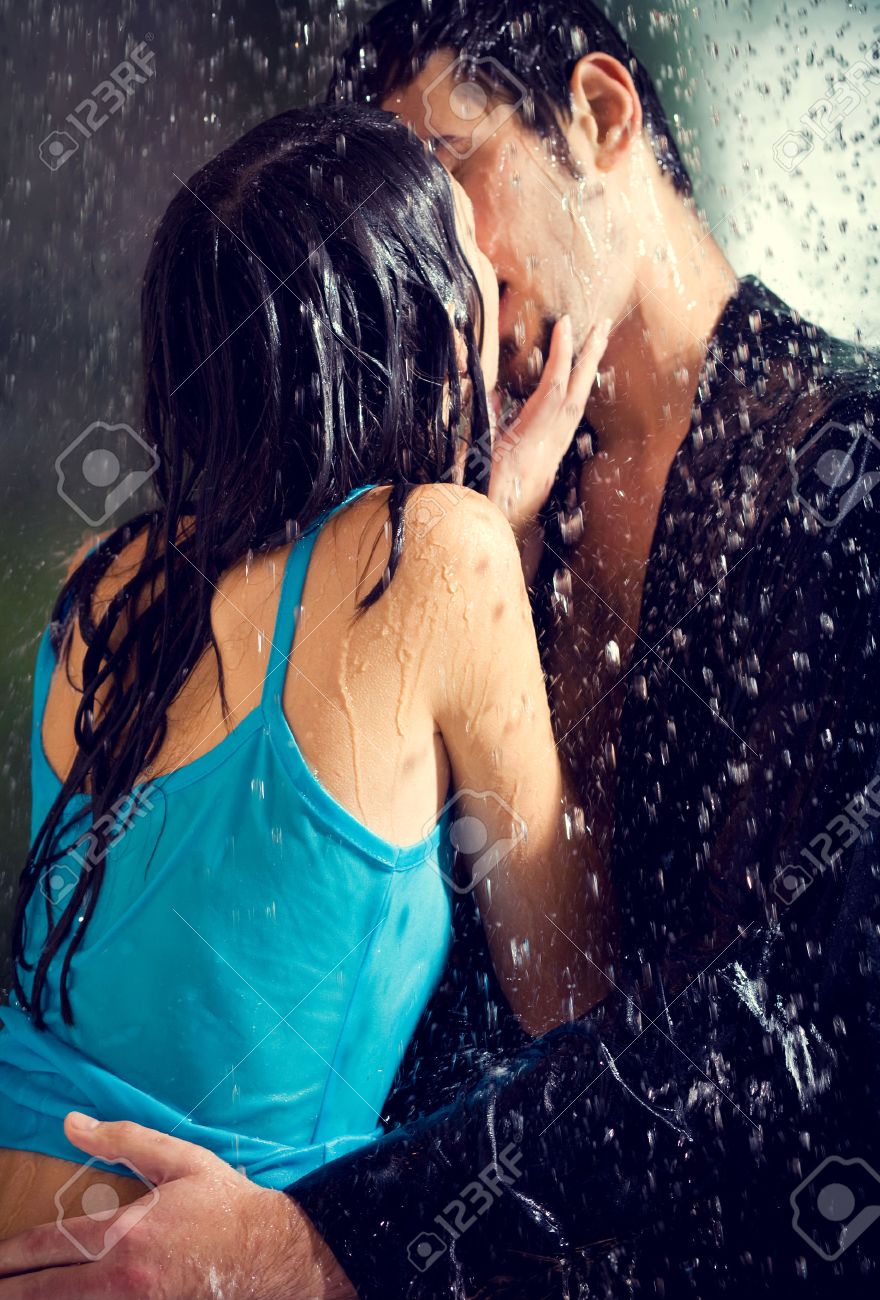 Young Hugging Couple Kissing Under A Rain, In Passion Stock Photo, Picture  And Royalty Free Image. Image 44395271.