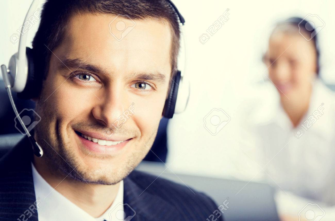 Two support phone operators at office, customer service concept - 46009296 Two support phone operators at office, customer service concept - 46009296