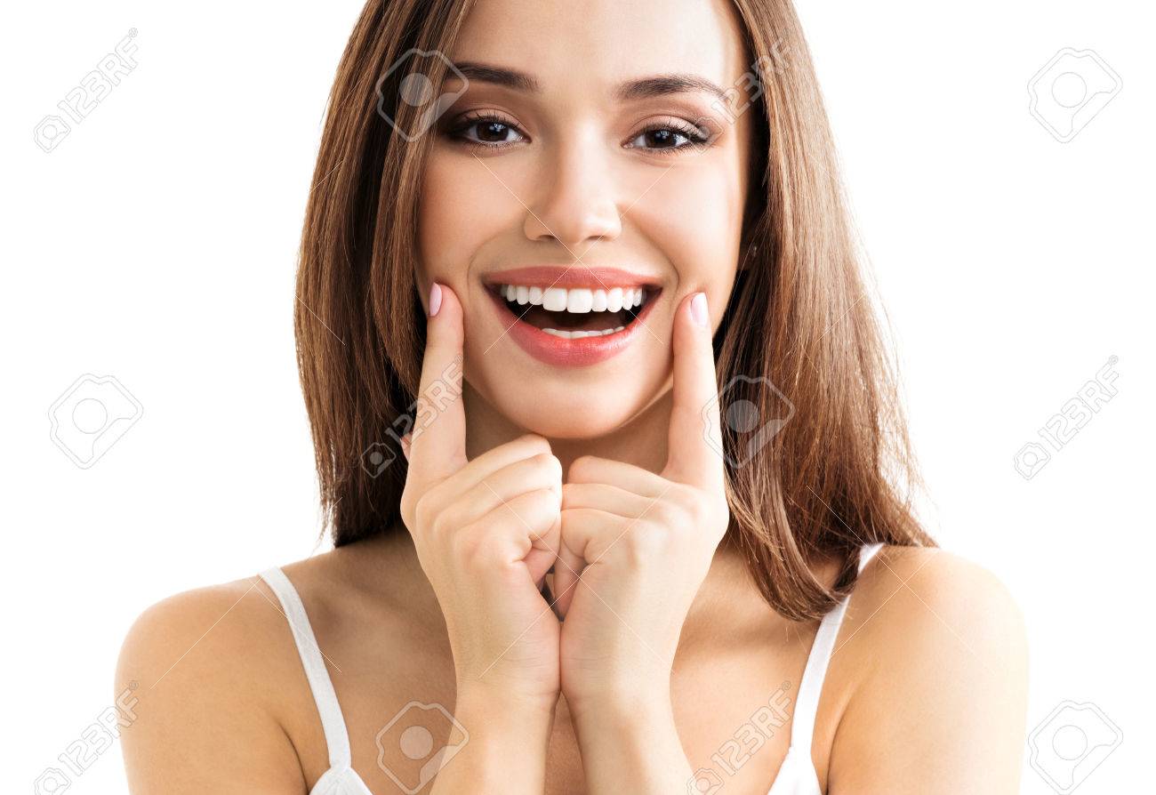 Young woman showing smile, in casual smart clothing, isolated against white background. Caucasian brunette model in emoshions and optimistic, positive, happy feeling concept studio shoot. - 64591580 Young woman showing smile, in casual smart clothing, isolated against white background. Caucasian brunette model in emoshions and optimistic, positive, happy feeling concept studio shoot. - 64591580