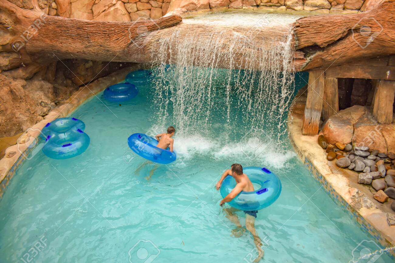 Orlando Florida April 07 19 Man And Boy Floating At Lazy Stock Photo Picture And Royalty Free Image Image