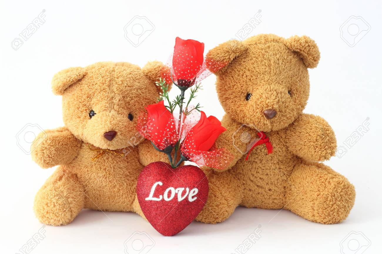 teddy bear holding roses