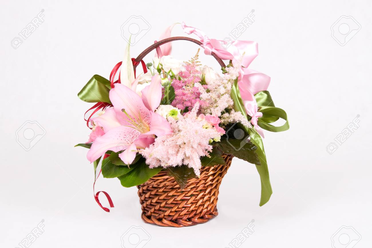 Basket full of variety flowers and green bow - 1414747 Basket full of variety flowers and green bow - 1414747