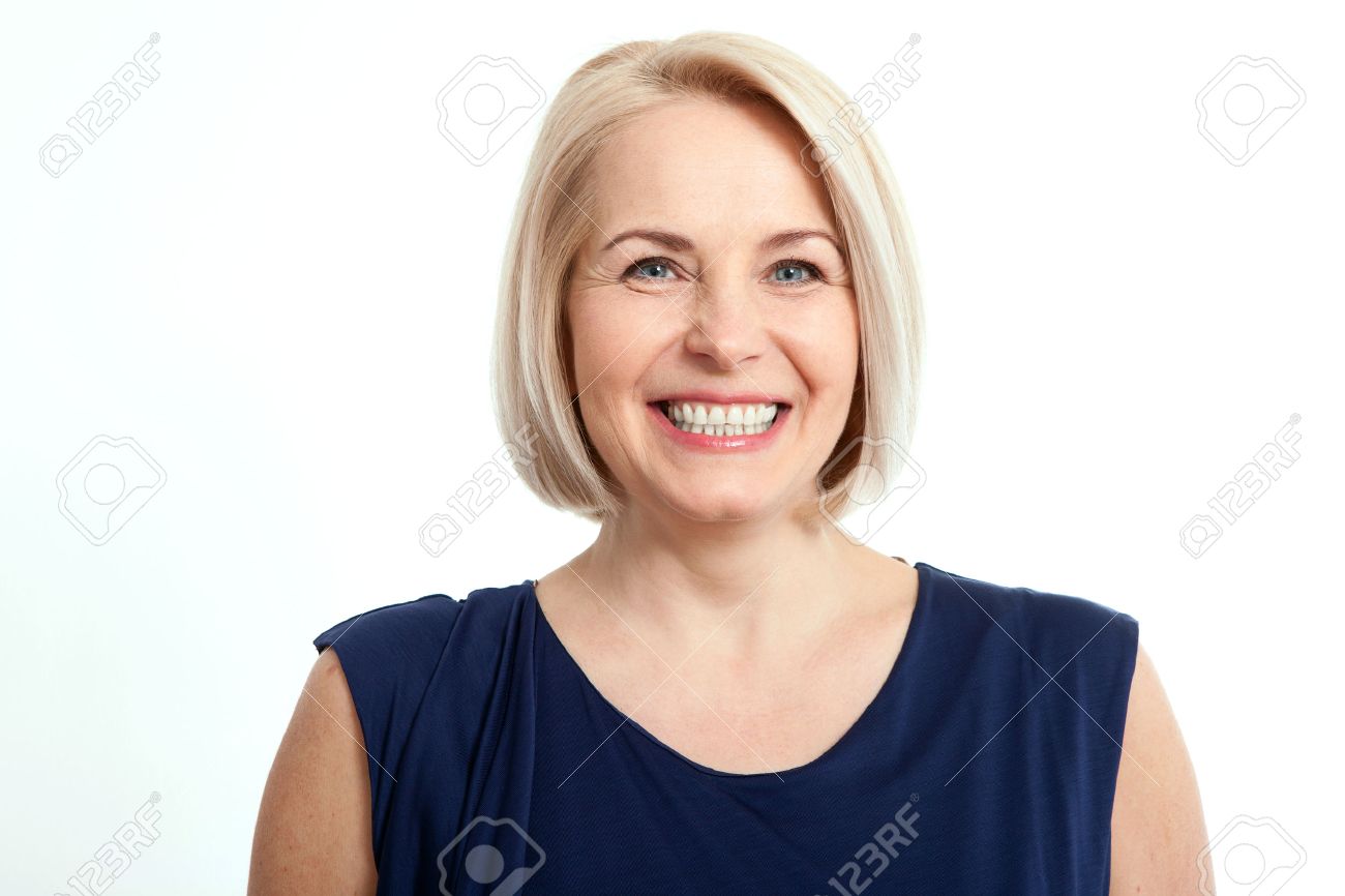 Friendly smiling middle-aged woman isolated on white background - 57872561 Friendly smiling middle-aged woman isolated on white background - 57872561