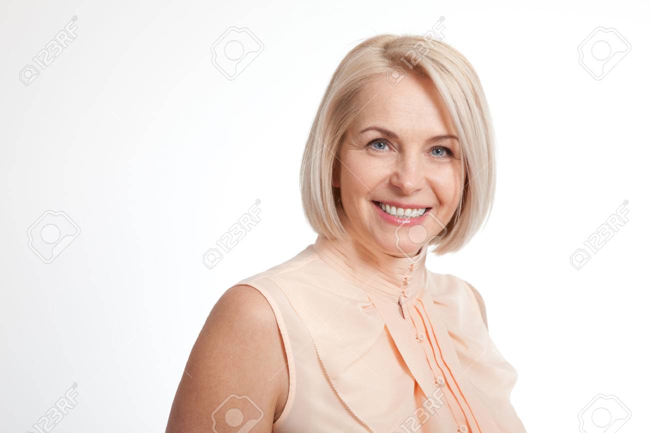 Friendly smiling middle-aged woman isolated on white background - 57869134 Friendly smiling middle-aged woman isolated on white background - 57869134