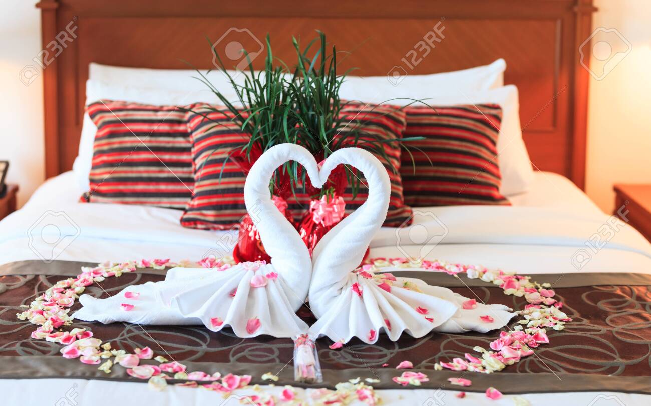 Romantic Bedroom Interior Kissing Swan Origami Towels And Sprinkled