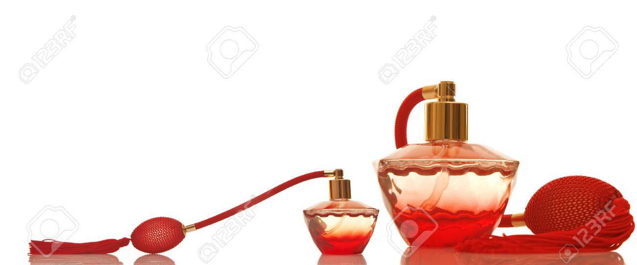 perfume in a red glass bottles on white background stock photo