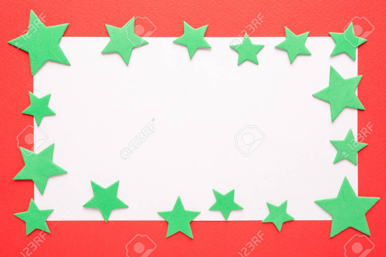 blank christmas card or invitation with green stars on red