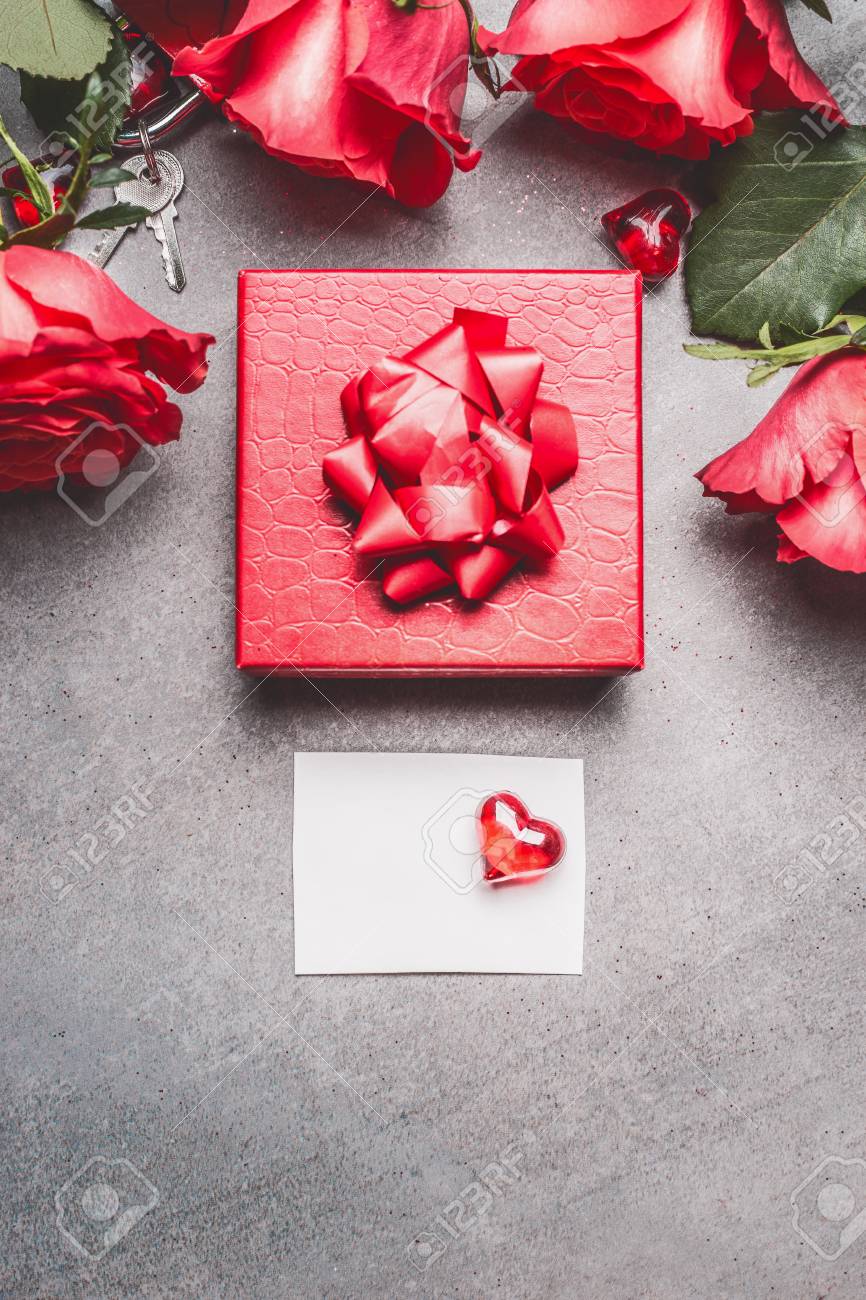 Red Gift Box With Roses And Blank Paper Card And Heart Top View