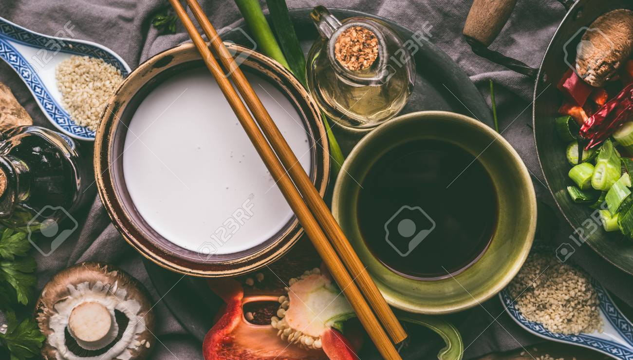 Bowls With Coconut Milk Soy Sauce Sesame Oil Chopsticks And