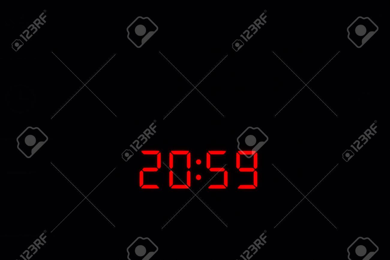 48511961-20-59-electronic-time-clock-with-red-illumination-on-black-background.jpg