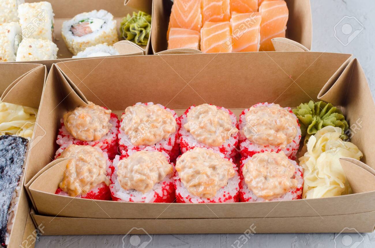 Download Tasty Sushi Rolls In Disposable Kraft Paper Boxes Sauce On Dark Stock Photo Picture And Royalty Free Image Image 147915369