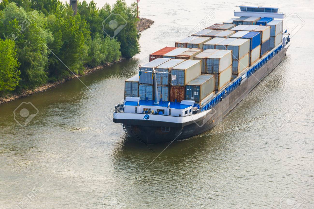 83211414-barge-shipping-containers-on-the-german-rhein-river.jpg