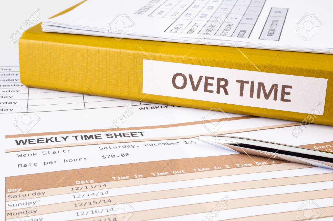 Overtime words on document binder place on blank weekly time sheets - 34899174 Overtime words on document binder place on blank weekly time sheets - 34899174
