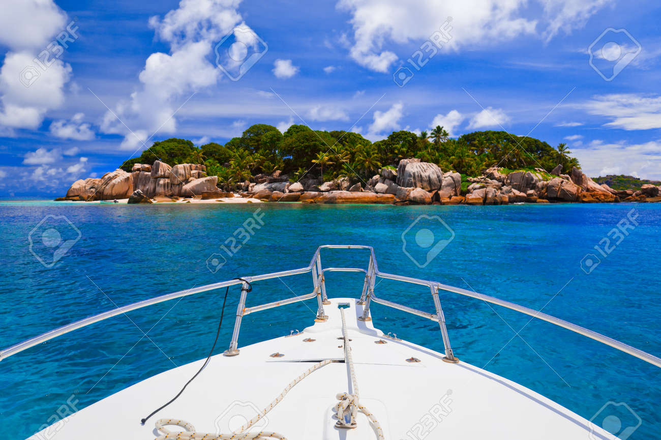 Tropical island and boat - nature background - 7084333 Tropical island and boat - nature background - 7084333