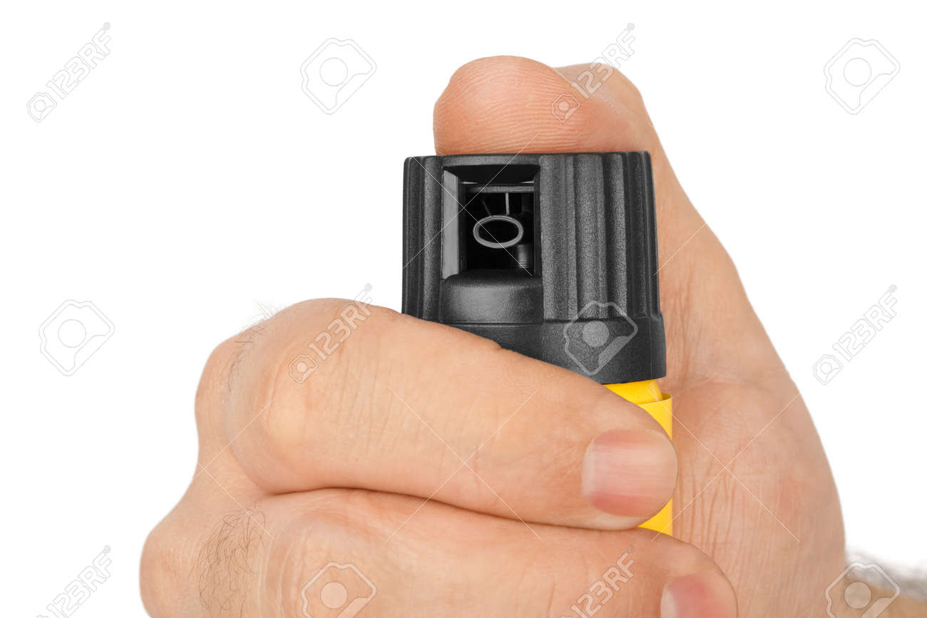 Hand with bottle of pepper spray isolated on white background - 40580059 Hand with bottle of pepper spray isolated on white background - 40580059