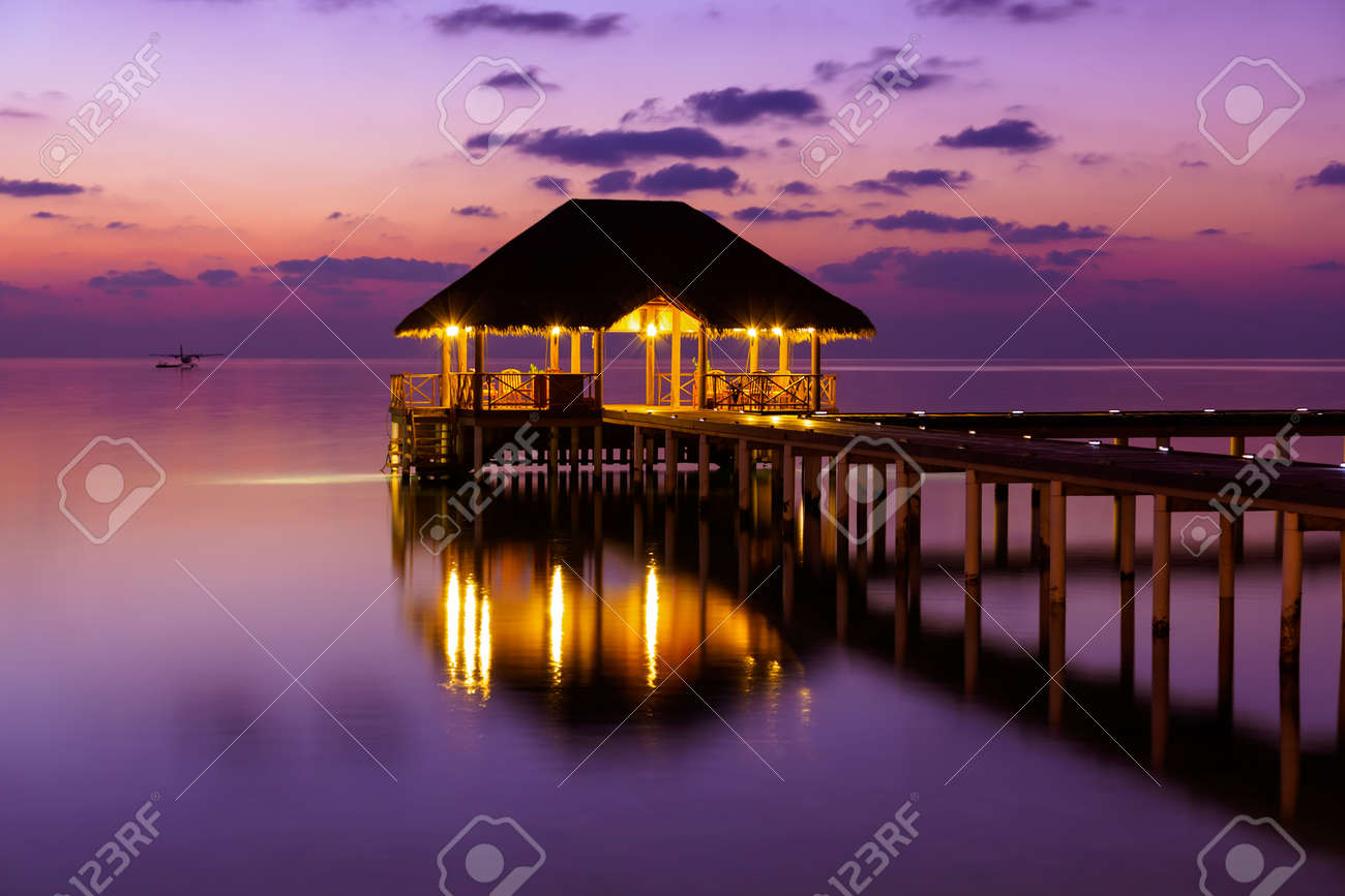 Water cafe at sunset - Maldives vacation background - 43524150 Water cafe at sunset - Maldives vacation background - 43524150
