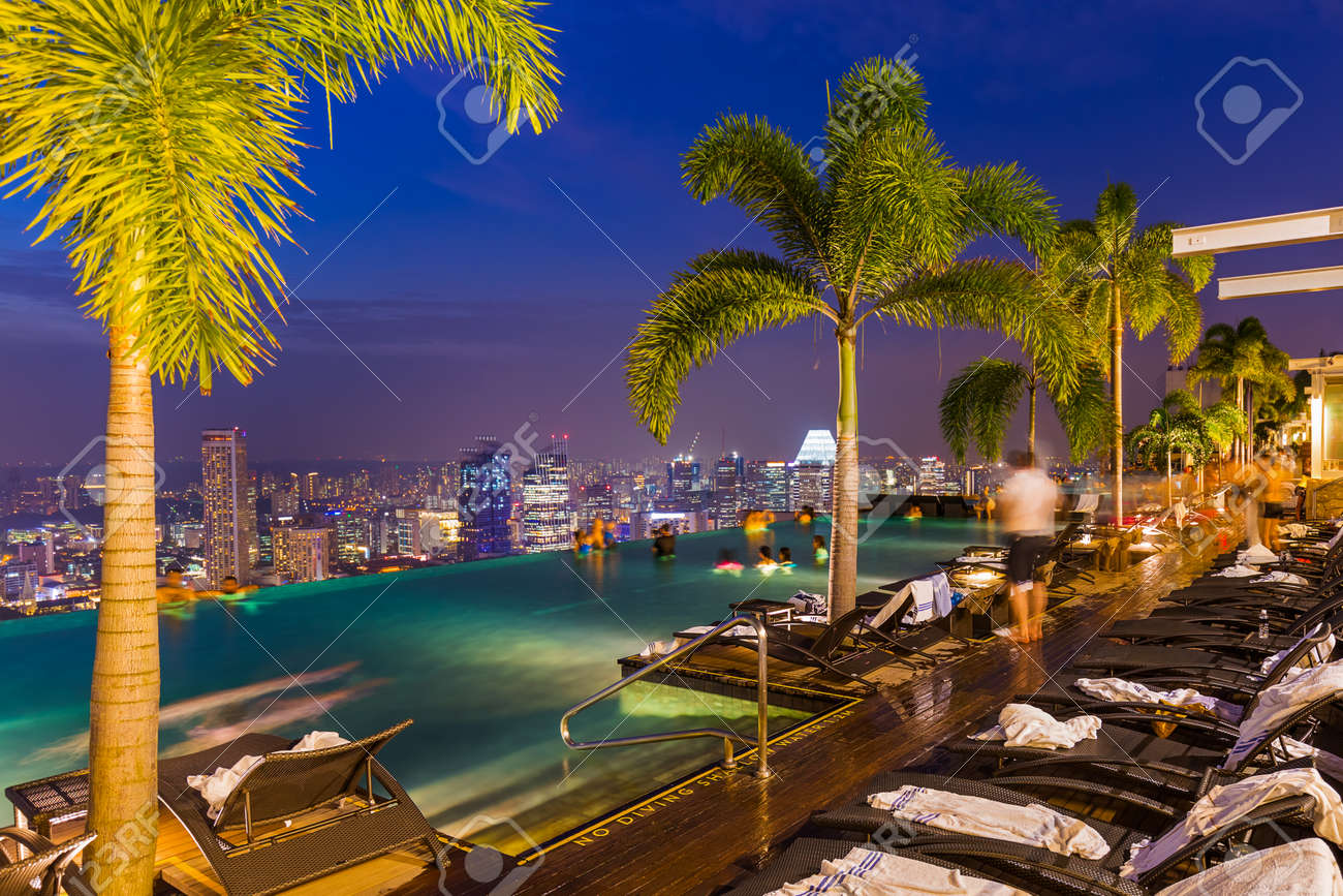 Pool on roof and Singapore city skyline - architecture and travel background - 57925031 Pool on roof and Singapore city skyline - architecture and travel background - 57925031