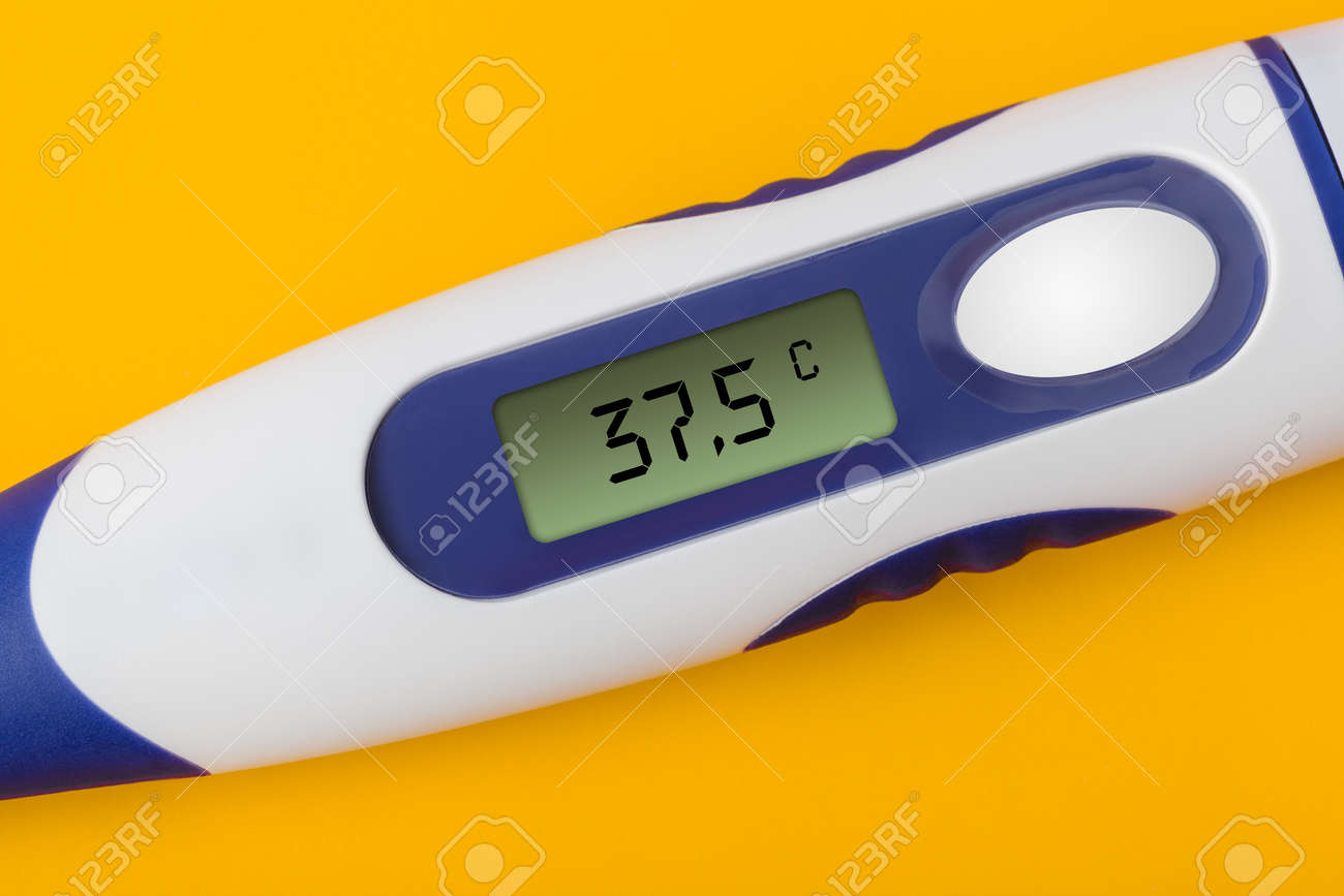 Electronic Medical Thermometer (37.5 Degrees) Isolated On Yellow Background  Stock Photo, Picture and Royalty Free Image. Image 157008848.
