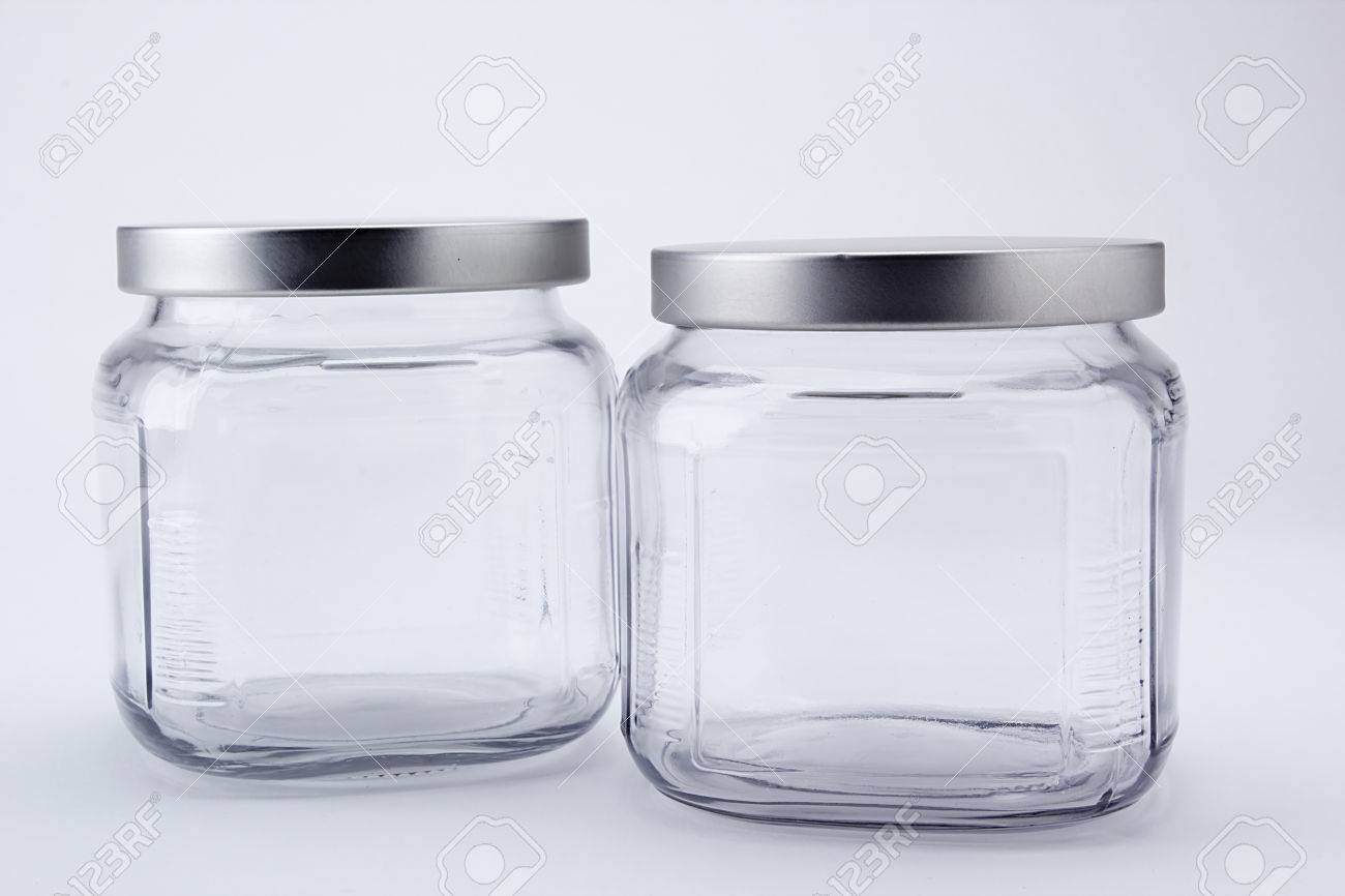 two faceted jars with lids for kitchen use stock photo picture and