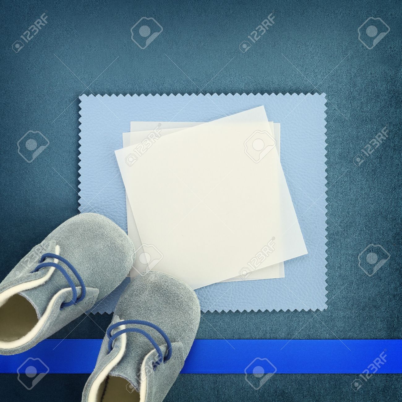 Blank Card With Baby Shoes On Blue Background Stock Photo Picture