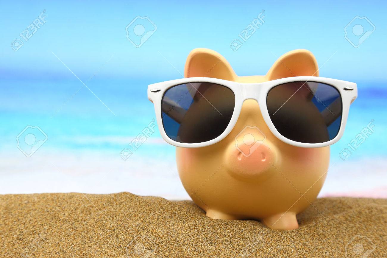 Summer piggy bank with sunglasses on the beach - 26815423 Summer piggy bank with sunglasses on the beach - 26815423