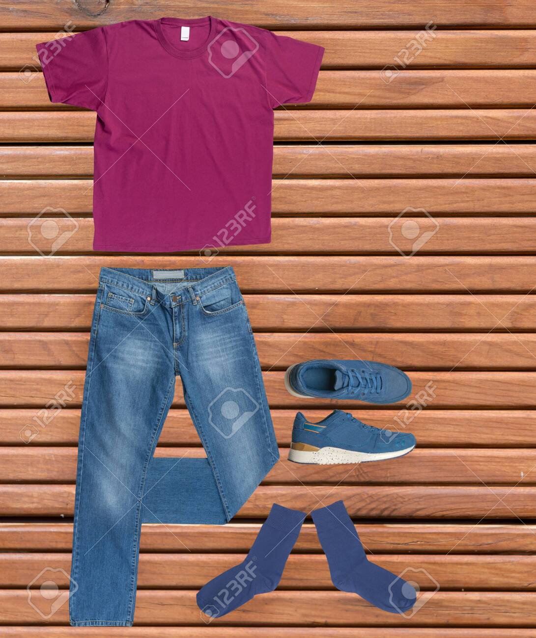 Flat Lay Men S Fashion Blue Jeans Blue Sneakers Red T Shirt Dark Blue Socks On A Wooden Background Casual Clothes Top View Stock Photo Picture And Royalty Free Image Image