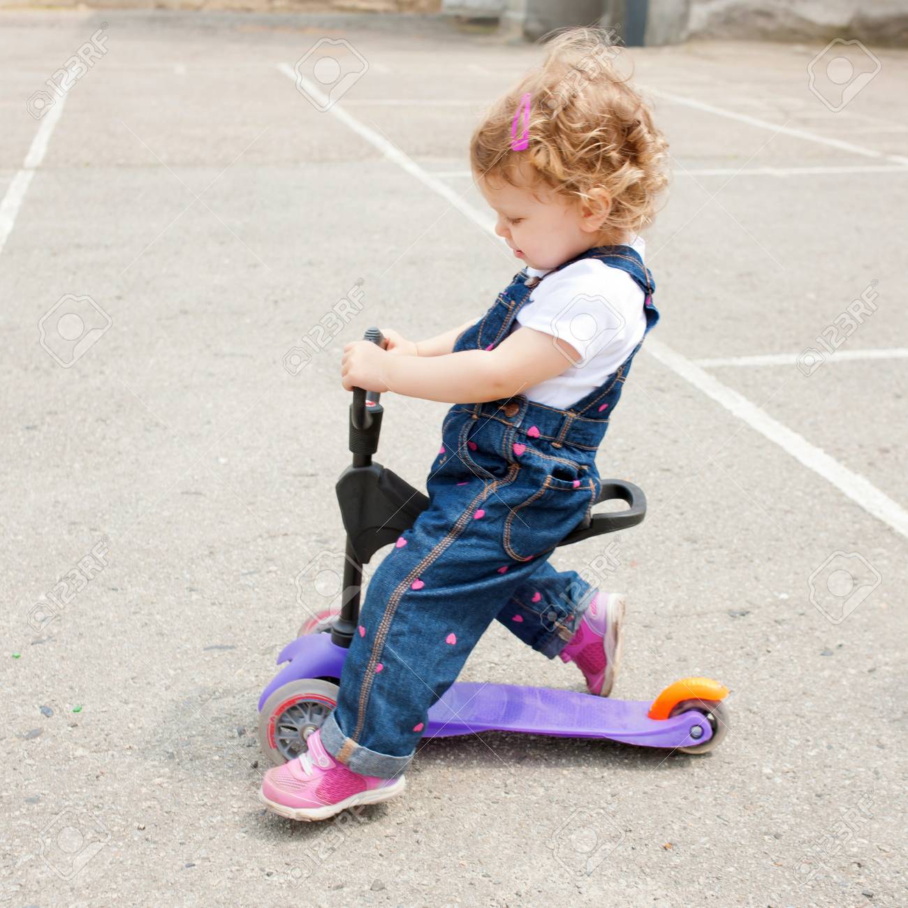 baby riding scooter