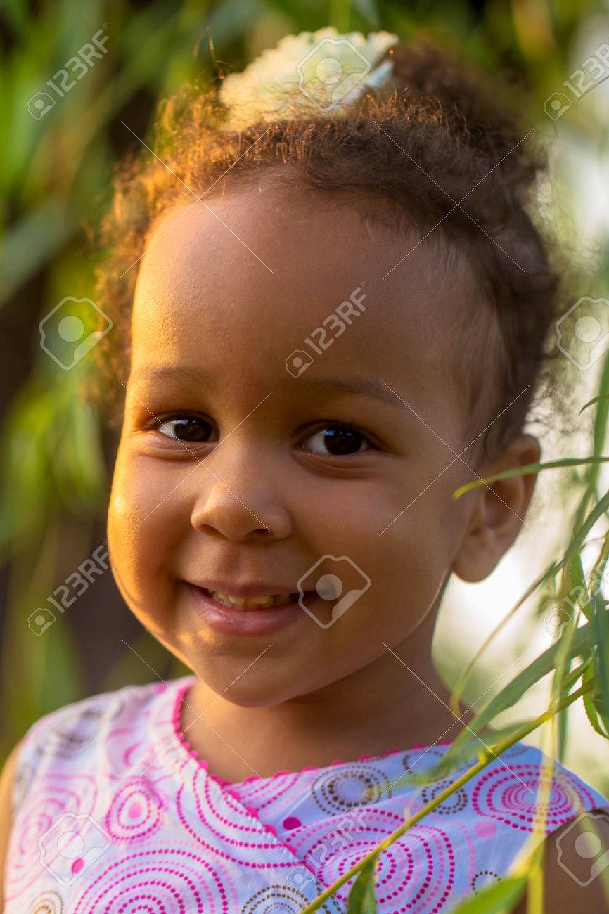 Portrait Of A Black Baby Girl Close Up Baby Smiles Among The Leaves Stock Photo Picture And Royalty Free Image Image Portrait Of A Black Baby Girl Close Up Baby Smiles Among The Leaves Stock Photo Picture And Royalty Free Image Image