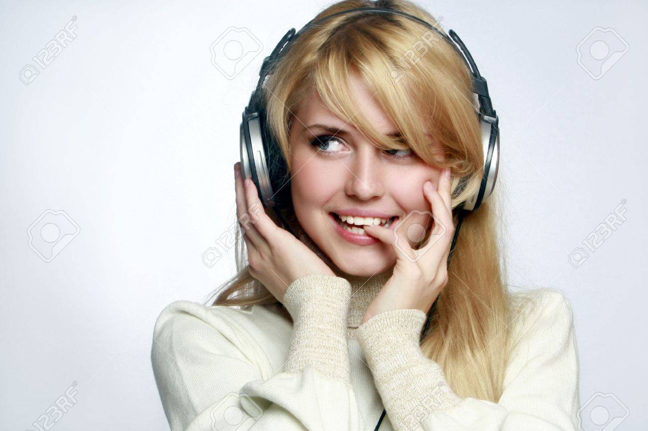 Beautiful Girl Listening Music In Headphones. Stock Photo, Picture and  Royalty Free Image. Image 5646742., image size:1300x866