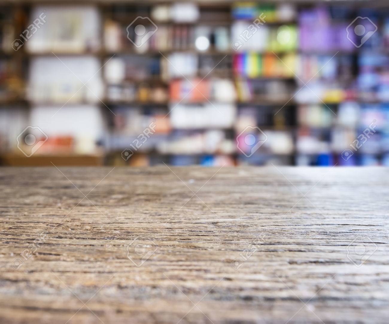 Table Top Counter With Blurred Bookshelf Bookshop Background Stock