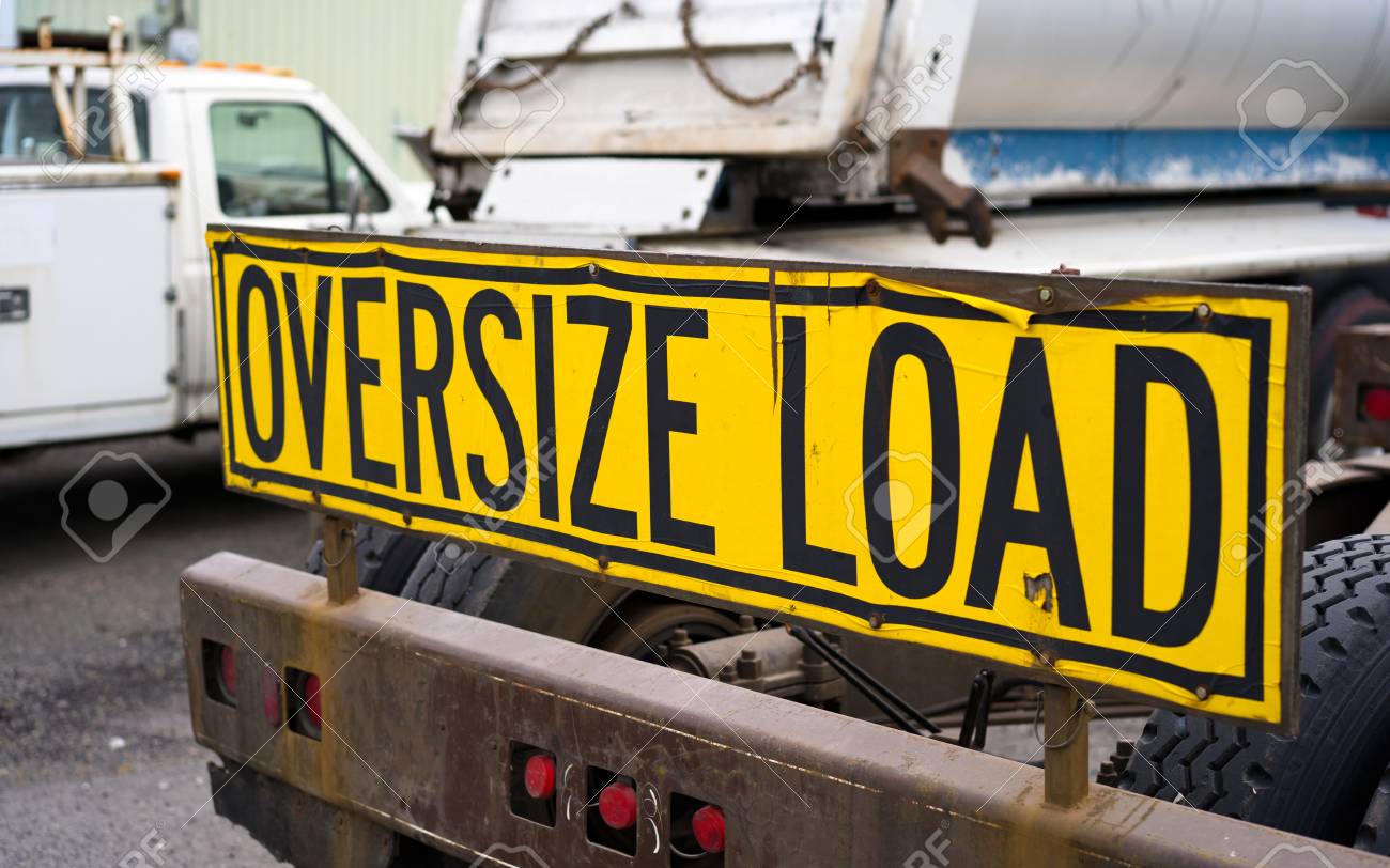 Wide Load Sign >> Black On Yellow Oversize Load Sign Installed On The Back Of Big Wide Load Sign >> Black On Yellow Oversize Load Sign Installed On The Back Of Big