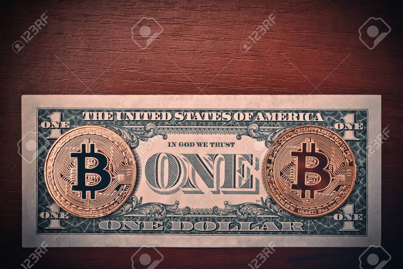 USA American Dollar Bill USD Fiat And Two Cryptocurrency Bitcoin Coins BTC  And On Brown Wood Table Stock Photo, Picture and Royalty Free Image. Image  132574776.