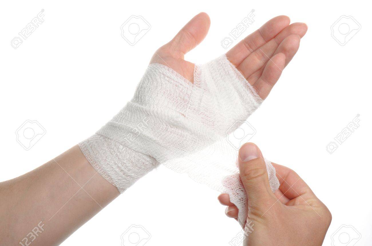 white medicine bandage on injury hand on white background stock