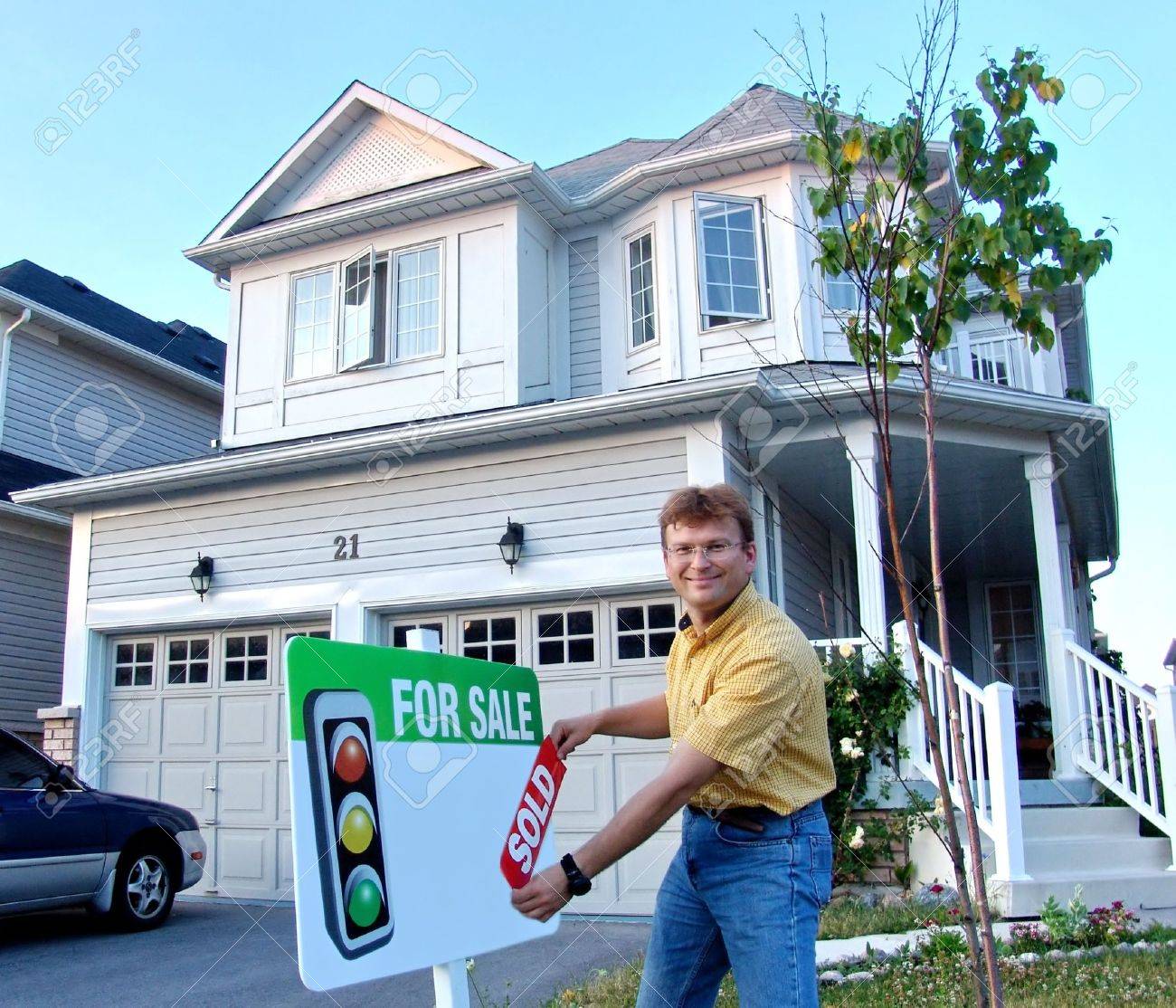 two story house in a modern suburban neighbourhood with house house sold by owner