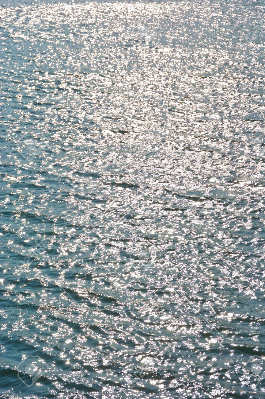 Shiny water surface with Illuminated sun lights - 5426272 Shiny water surface with Illuminated sun lights - 5426272