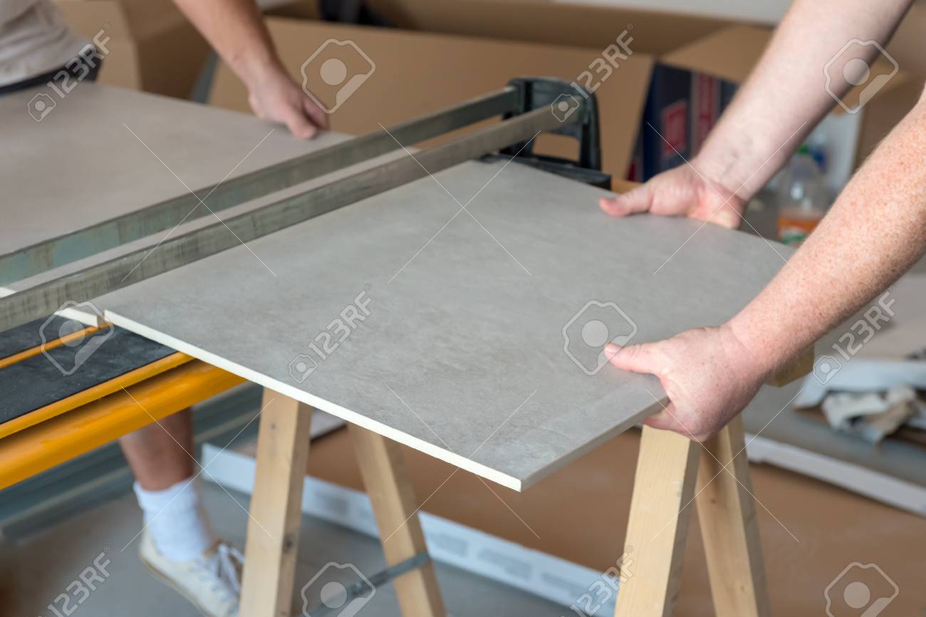 Workers Cutting Ceramic Floor Tiles Tile With Tile Cutter Stock