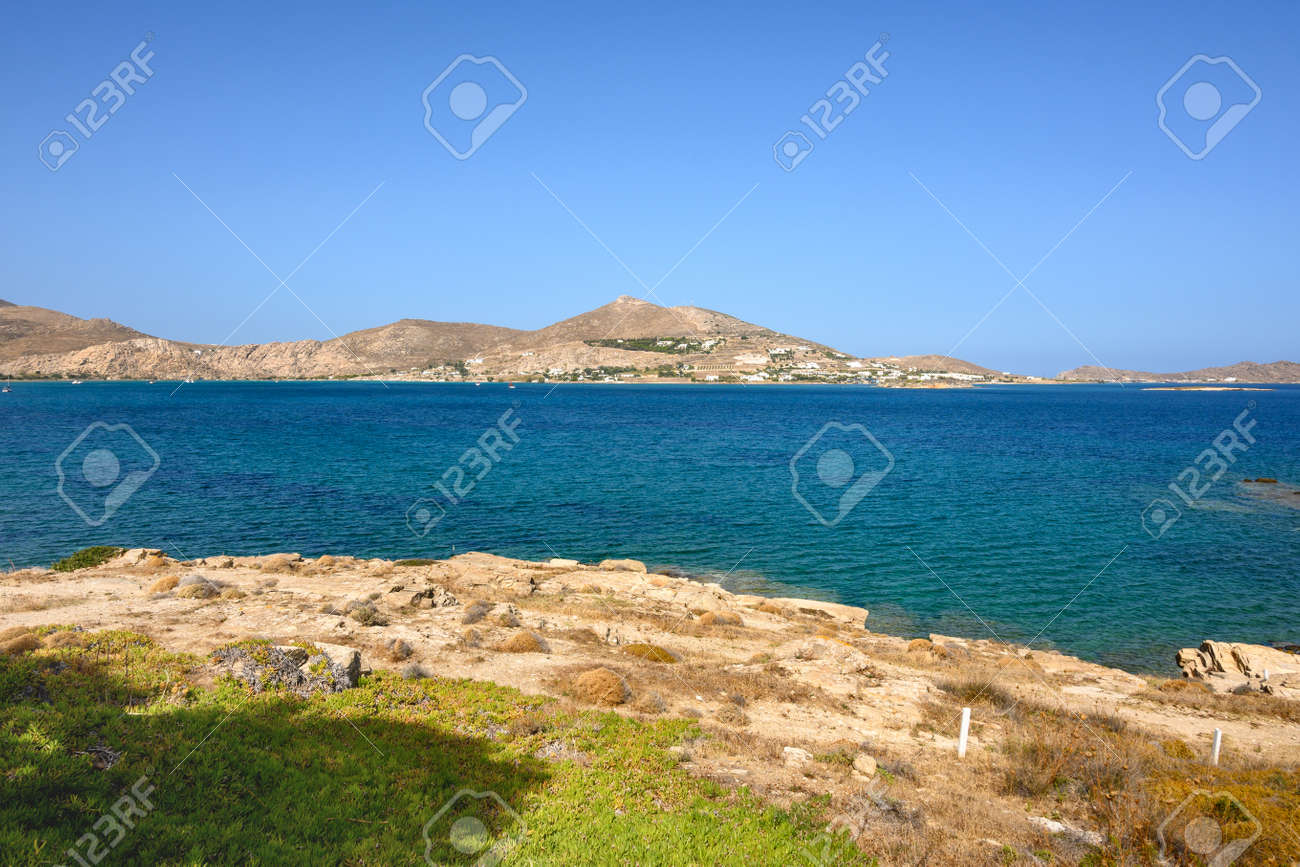 Beautiful bay with blue crystal waters in Naoussa village. Paros island, Greece - 169388174 Beautiful bay with blue crystal waters in Naoussa village. Paros island, Greece - 169388174