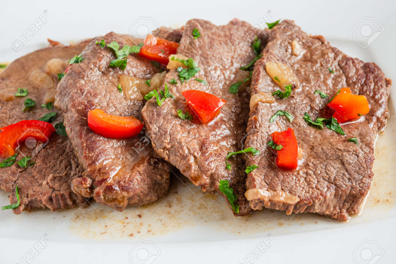 Braised beef cooked with red pepper, served on a plate - 169388207 Braised beef cooked with red pepper, served on a plate - 169388207