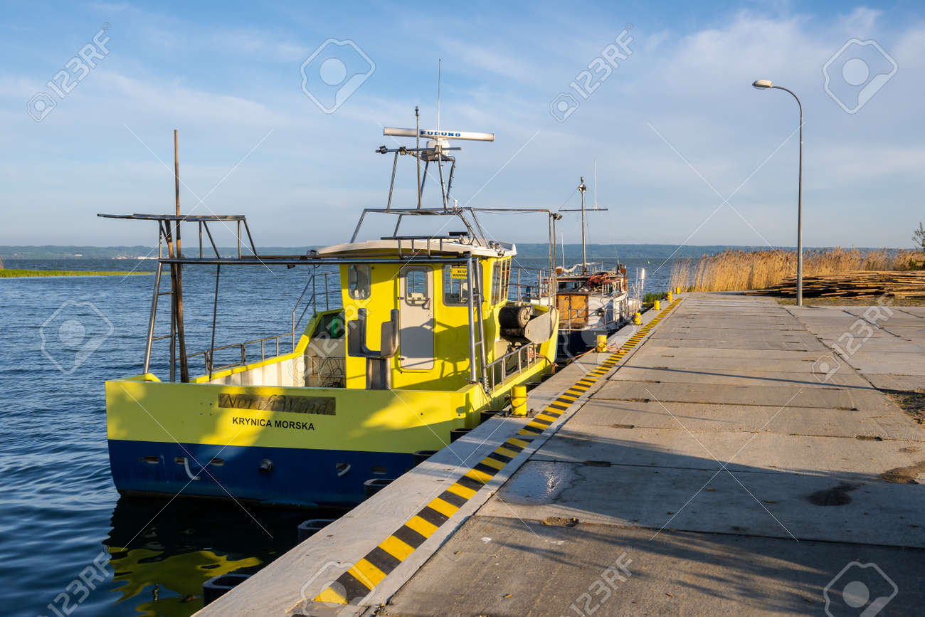 Krynica Morska, Poland - May 15, 2021: The wharf in the fishing port in Krynica Morska on Vistula Spit. Baltic Sea - 169381680 Krynica Morska, Poland - May 15, 2021: The wharf in the fishing port in Krynica Morska on Vistula Spit. Baltic Sea - 169381680
