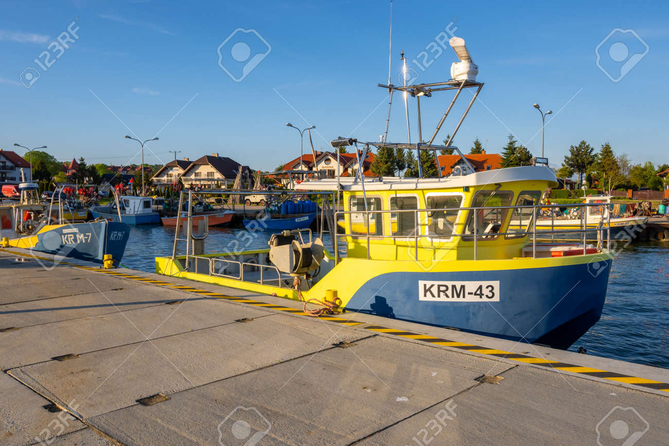 Krynica Morska, Poland - May 15, 2021: Fishing boat docked in port of Krynica Morska on Vistula Spit. Baltic Sea - 169381684 Krynica Morska, Poland - May 15, 2021: Fishing boat docked in port of Krynica Morska on Vistula Spit. Baltic Sea - 169381684