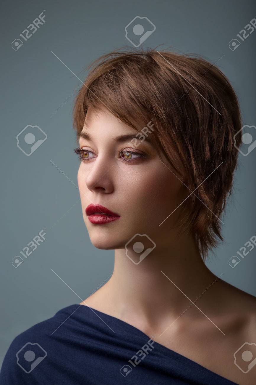 Side Portrait Of A Young Woman With Short Brown Hair And Brown