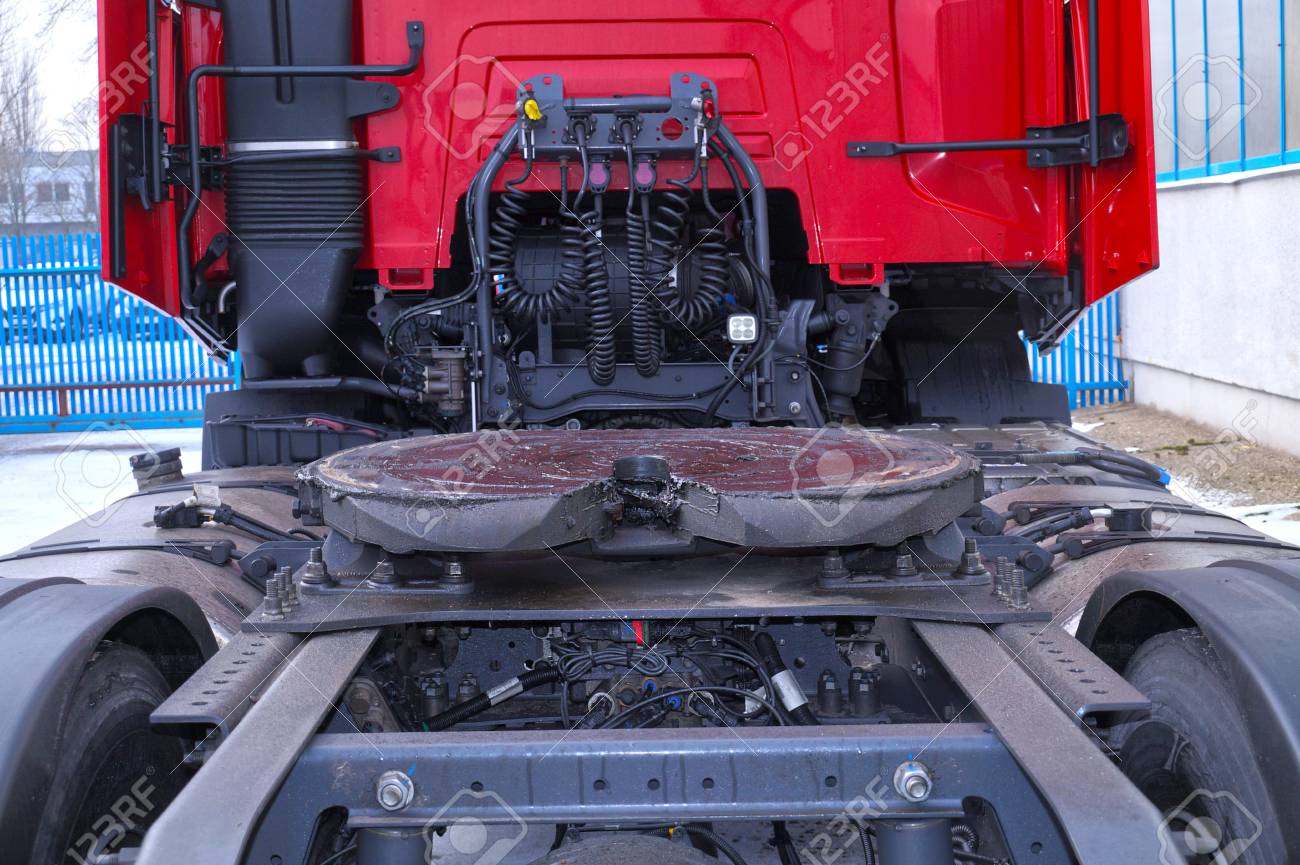 View of the back part of the 18 wheeled truck. Visible fifth wheel couplings are fitted to a tractor unit to connect it to the trailer. - 117265629 View of the back part of the 18 wheeled truck. Visible fifth wheel couplings are fitted to a tractor unit to connect it to the trailer. - 117265629