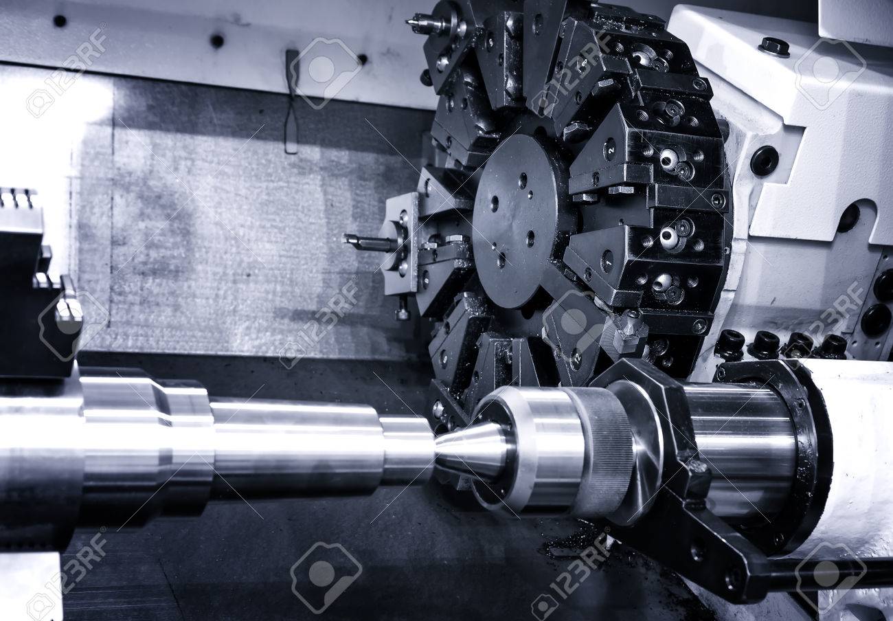Rotating head with drilling machine bits and tools in high precision mechanics plant at CNC lathe in workshop - 64067881 Rotating head with drilling machine bits and tools in high precision mechanics plant at CNC lathe in workshop - 64067881