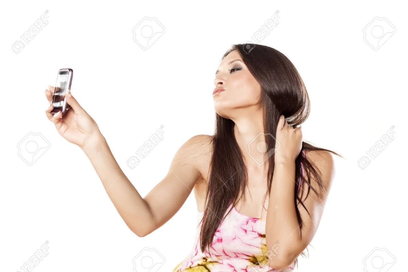nice girl make a self portrait with her smartphone and make a