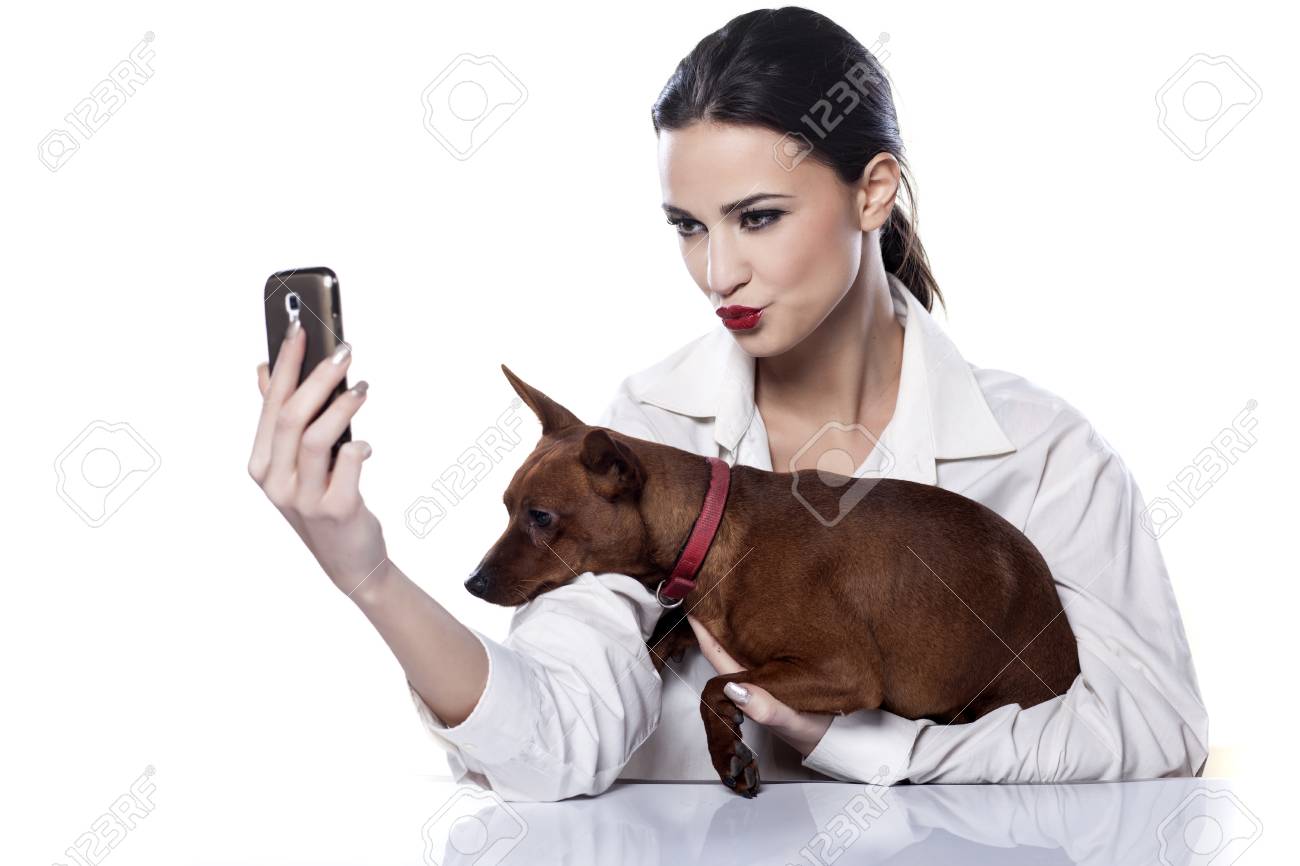 girl and dog make themselves self portrait by phone stock photo