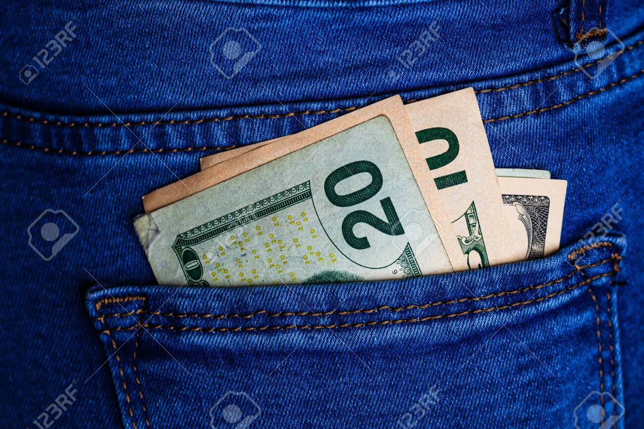 Banknotes Close Up, Money In A Jeans Pocket. Dollars Stick Out.. Stock  Photo, Picture And Royalty Free Image. Image 135888395.
