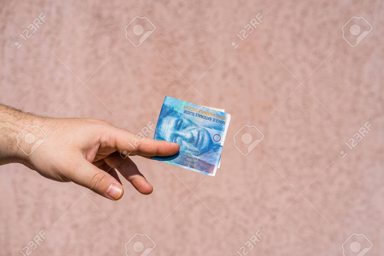 Hand Holding Showing Euro Money And Giving Or Receiving Money Stock Photo Picture And Royalty Free Image Image 141519839