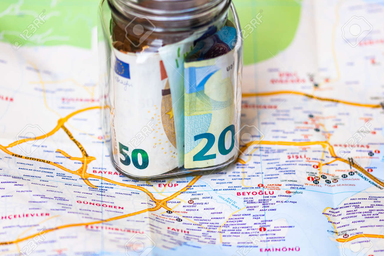 Composition with saving money banknotes in a glass jar. Concept of investing and keeping money for dreams and travel, close up isolated. - 158199153 Composition with saving money banknotes in a glass jar. Concept of investing and keeping money for dreams and travel, close up isolated. - 158199153