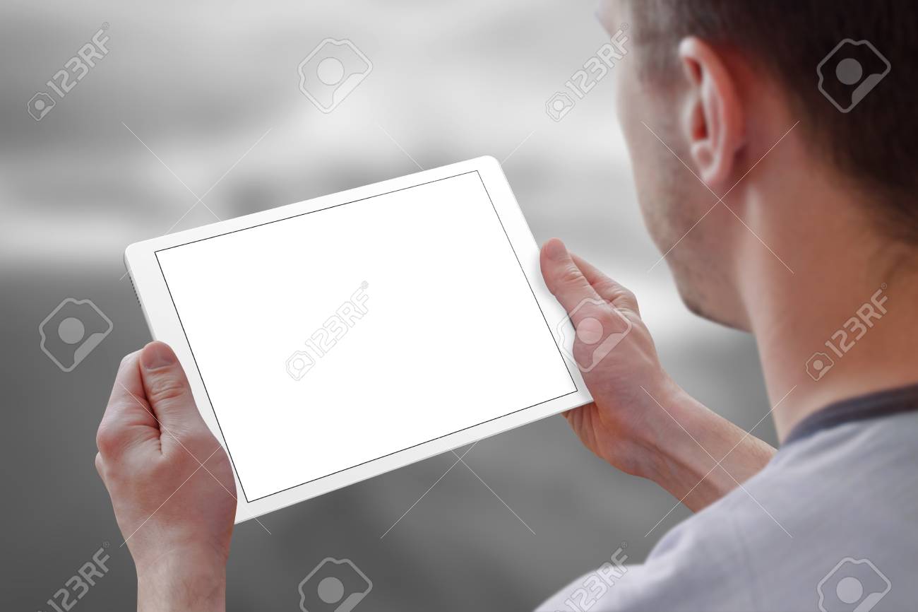 tablet with isolated screen for mockup in man hands city life