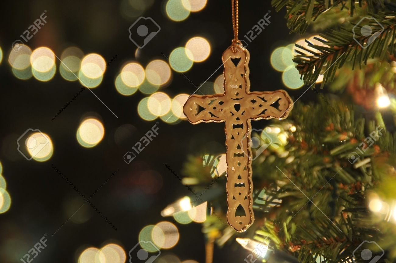 Cross Ornament On Christmas Tree With Bokeh Taken A Remote To Reduce Blur At Cross Ornament On Christmas Tree With Bokeh Taken A Remote To Reduce Blur At